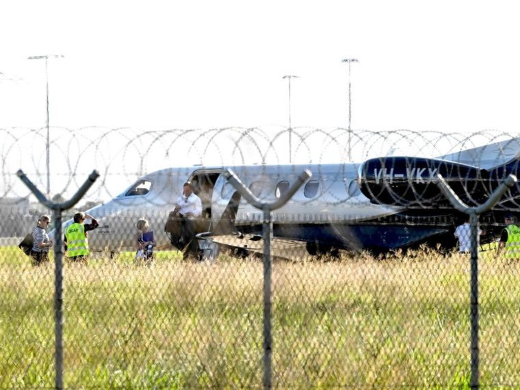 QLD Premier Steven Miles and staff exit a private jet, VH-VKX, at the Government Air Wing, Brisbane Airport. pic: Lyndon Mechielsen/Courier Mail