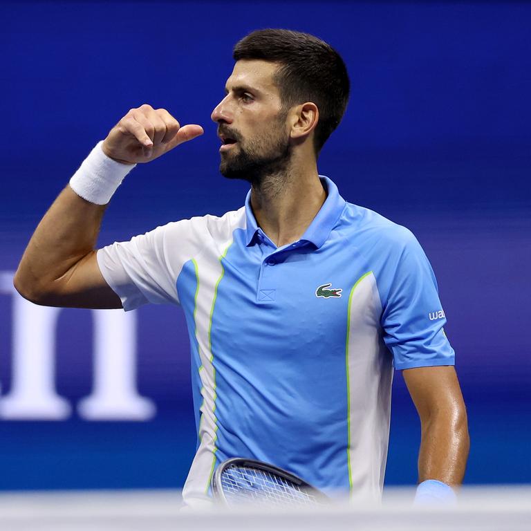 Novak Djokovic hangs up the phone. (Photo by Mike Stobe/Getty Images)