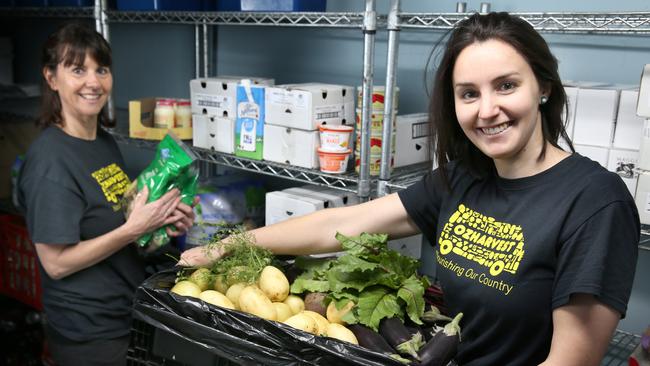 Rachel Hibble, right, works as an engagement coordinator for food rescue charity OzHarvest, alongside Leah Sprigg, left. Picture: Dean Martin