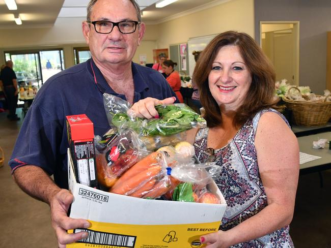 Hornsby Connect president Steve Hopwood and grocery shop manager Lynnette Ivimey with a typical shopping box available for needy clients. Picture: Joel Carrett