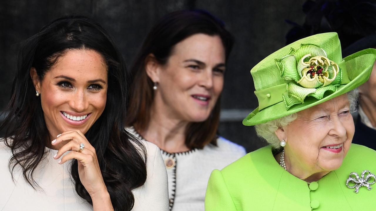 Meghan Markle sits with former palace aide, Australian Samantha “the Panther” Cohen, and the Queen in 2018. Picture: Getty Images