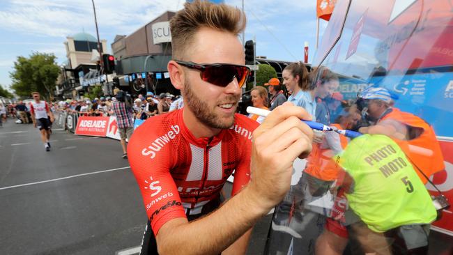 Chris Hamilton signs in at the start of Stage 1 of the Tour Down Under in Adelaide. Picture: AAP