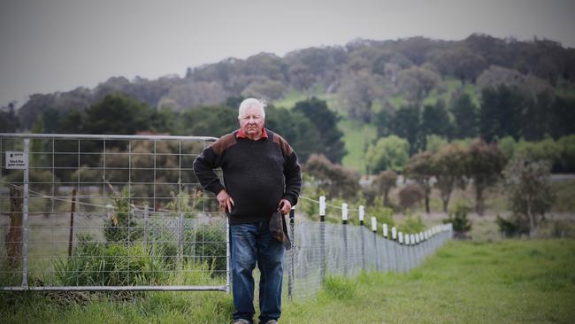 Miles Hedge with the proposed McPhillamys mine site directly behind him. Picture: Graham Schumman