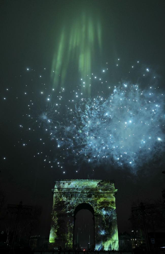 Fireworks illuminate the sky around the Arc de Triomphe on the Avenue des Champs-Elysees in Paris. Picture: AFP