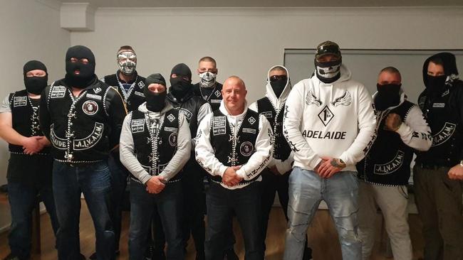 Alexander Ilich, unmasked, surrounded by fellow members of the Rock Machine bikie gang. Picture: Facebook