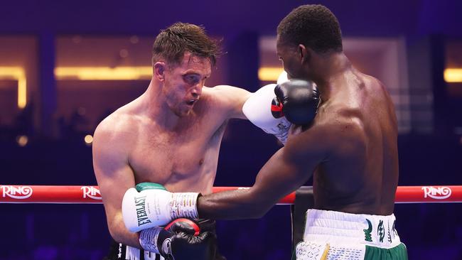 Callum Smith punches Joshua Buatsi. Photo by Richard Pelham/Getty Images.