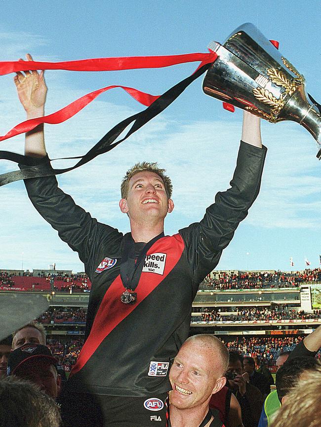 James Hird celebrates with the 2000 premiership cup.