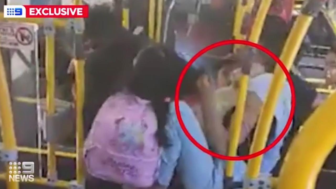 A woman can be seen holding her baby close to her chest. Picture: Channel 9