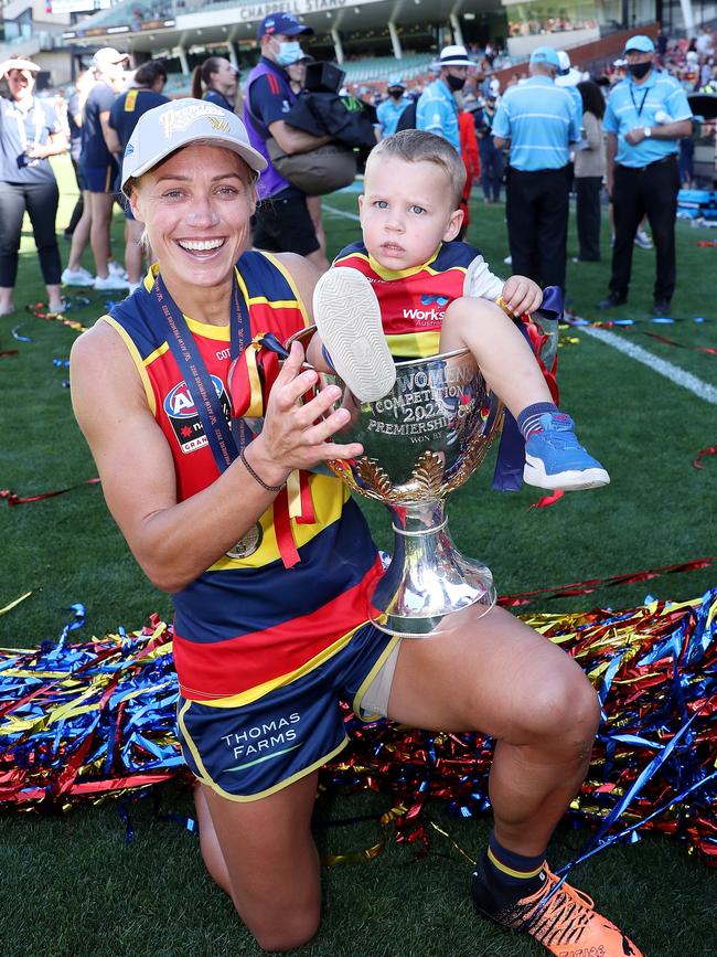 Erin Phillips with her son Drew celebrating the Crows third grand final victory. Picture: Sarah Reed