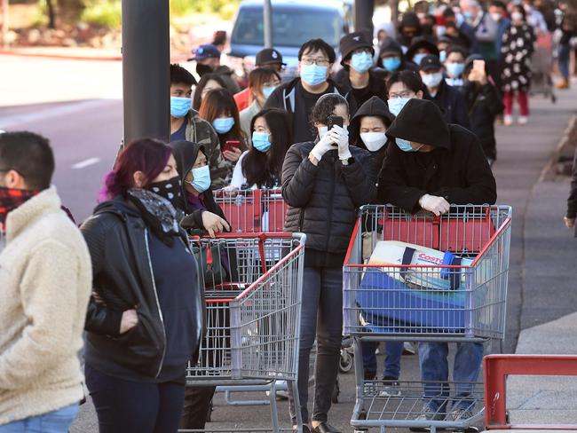 Shoppers wait in a long queue outside a Costco outlet in Melbourne. Picture: AFP