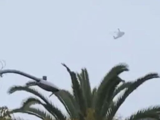 The helicopter, believed to be carrying Kobe Bryant, flies over Glendale in California, moments before crashing into a hillside. Picture: Supplied