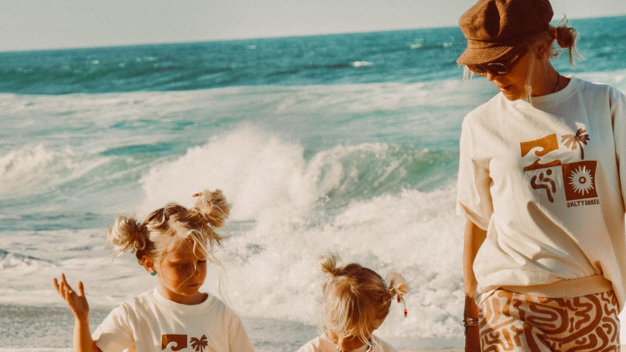 Salty Shreds owner and designer Ashley Reynolds with her children, Bryxton, 4, Ziggy, 2, and Ocean, 1.