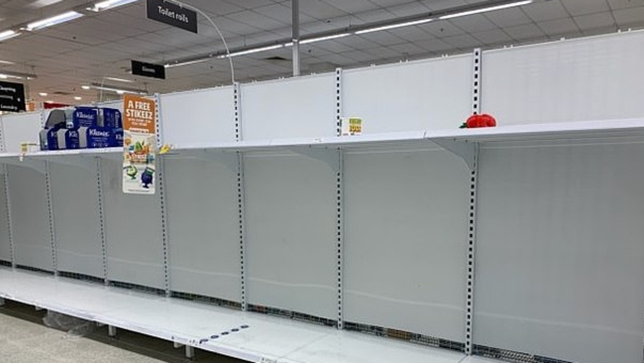 Emptied shelves in the toilet paper section of Coles in the Perth suburb of Claremont.