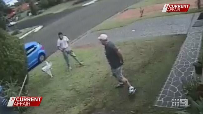Terror suspect Ihsas Khan attempting to force his way into a salon in pursuit of Wayne Greenhalgh. Picture: Channel 9 / ACA