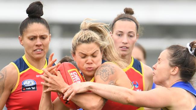 Adelaide midfielder Anne Hatchard is tackled during the round five AFLW match between North Melbourne at North Hobart Oval. Picture: Steve Bell/Getty Images