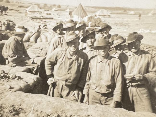 Keith Arneman (back middle) pictured with mates during his service in the Middle East during World War II.