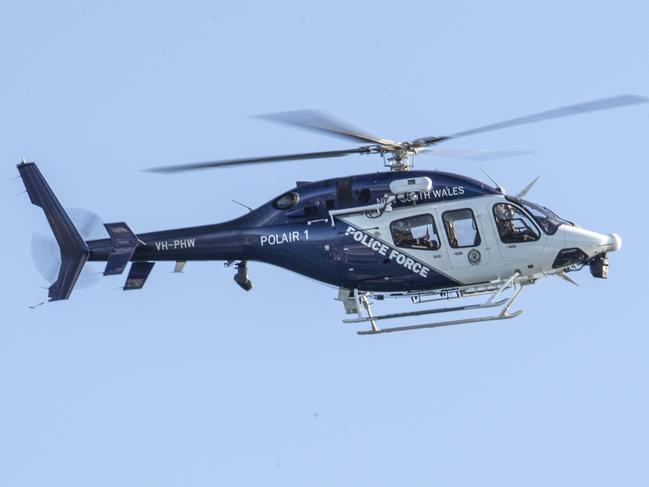 PolAir spent Saturday morning searching the water off Sydney’s eastern beaches and cliffs. Picture: Monique Harmer