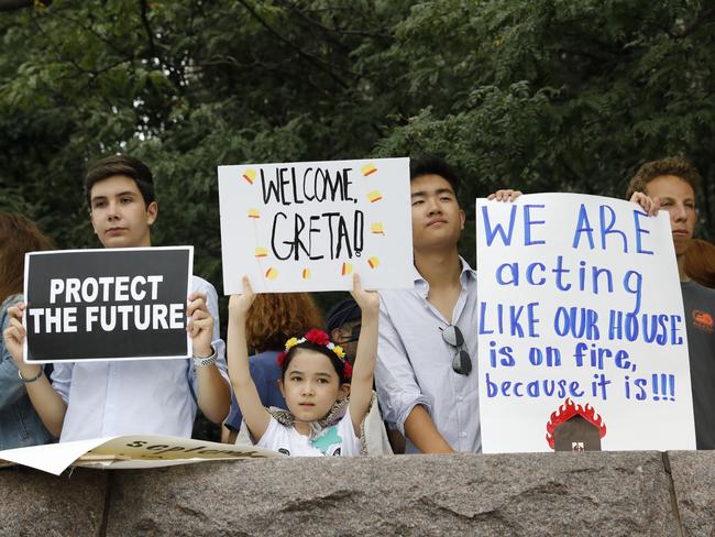 Supporters of Greta Thunberg await her arrival at a marina in New York. Picture: AP