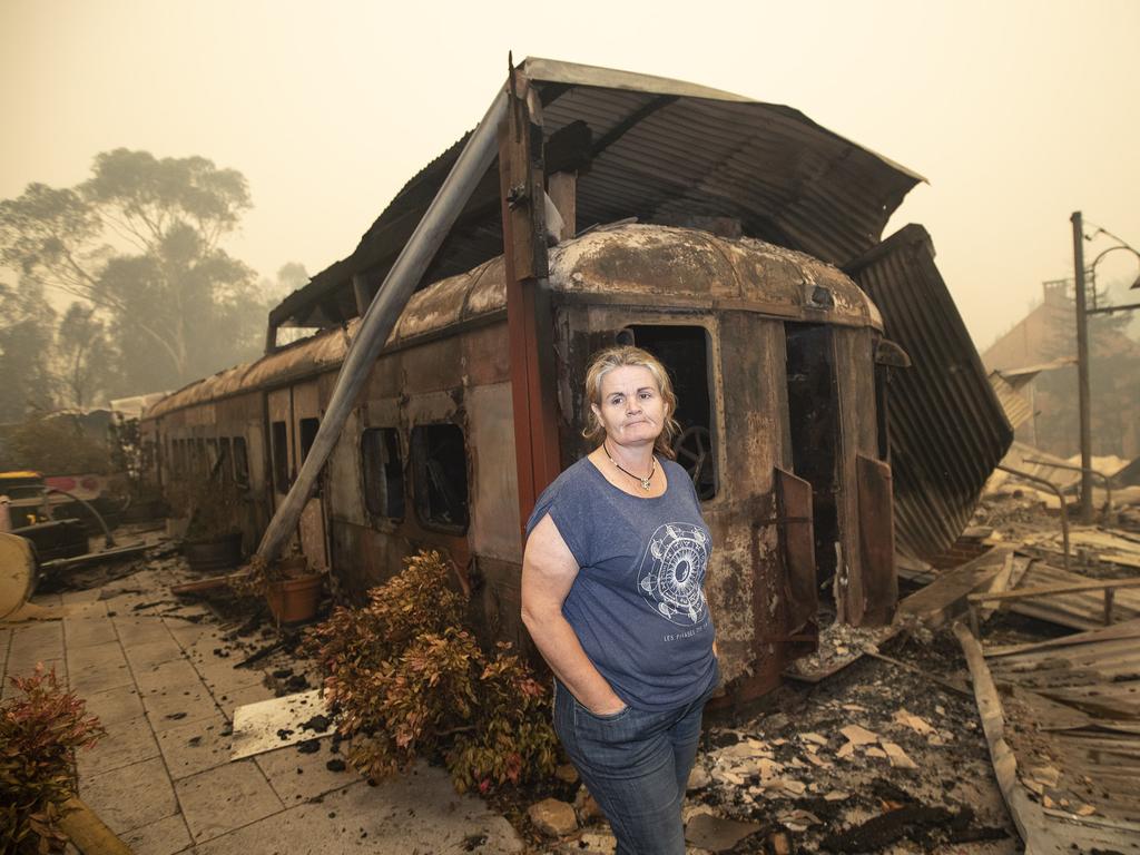 Cobargo resident Ange Kane outside a burnt-out cafe. Picture: Gary Ramage