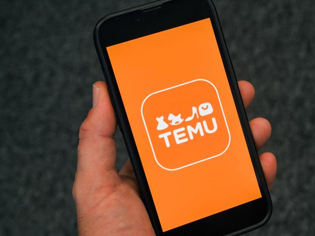 (FILES) This photo illustration shows the logo of fast fashion e-commerce company Temu displayed on a mobile phone in Brussels, on November 4, 2024. The US Postal Service (USPS) has said it is temporarily suspending inbound parcels from China and Hong Kong, evoking an angry accusation of "unreasonable suppression" from Beijing on February 5, 2025. US officials pointed to the growth of Chinese-founded online retailers Shein and Temu as a key factor behind this surge in shipments claiming the exemption in recent years  -- and the halt on February 4 could delay parcels from both companies from entering the country. (Photo by Nicolas TUCAT / AFP)