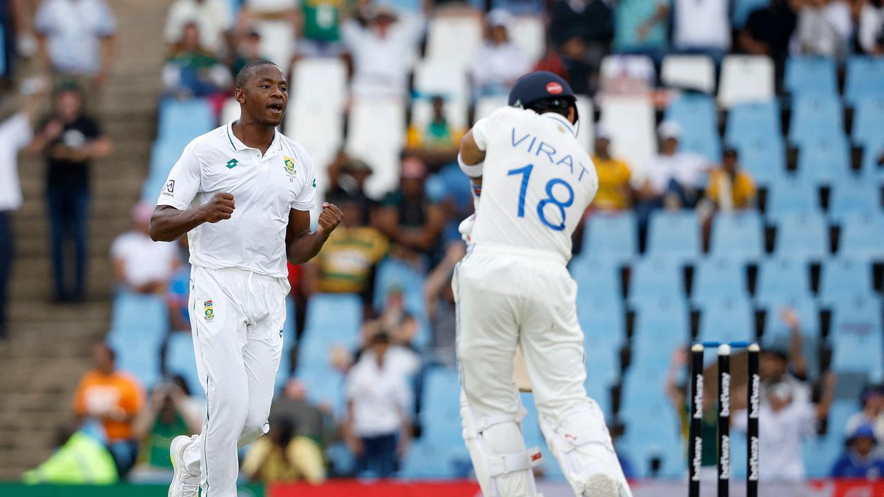 South Africa's Kagiso Rabada (L) celebrates after the dismissal of India's Virat Kohli (R) during the first day of the first cricket Test match between South Africa and India at SuperSport Park in Centurion on December 26, 2023. (Photo by PHILL MAGAKOE / AFP)