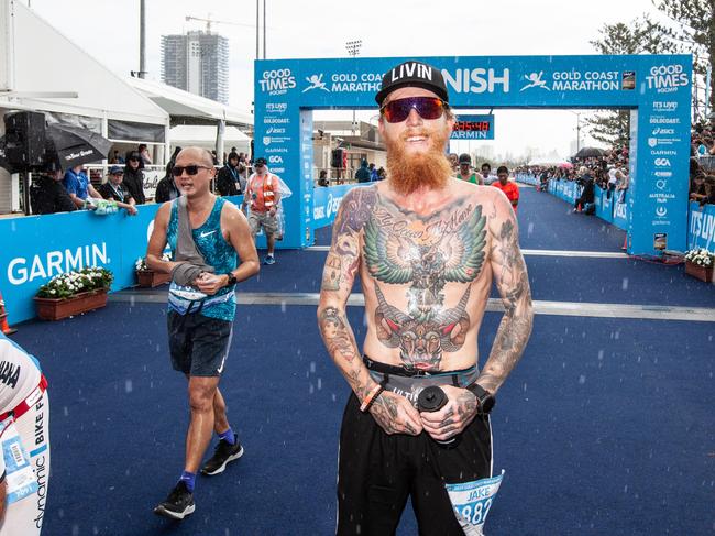 Gold Coaster Jake Malby finishes the 2019 Gold Coast Marathon. He will run 31 marathons in 31 days in August.