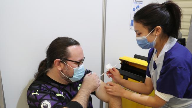 MELBOURNE, AUSTRALIA - NewsWire Photos. MAY 25, 2021: Mike Lavery gets his COVID-19 vaccination at the  the vaccination centre in Melbourne Showgrounds,  Flemington. Picture: NCA NewsWire / David Crosling