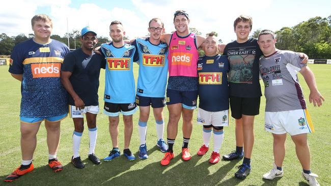 Members of the Gold Coast Titans PDRL team with Titan Jarrod Wallace (pink) at the club’s training facility at Parkwood. Picture Glenn Hampson