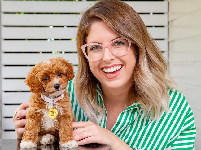 Lana Sciasci, of Red Hill, with eight-week-old Toy Cavoodle Ziggy. The breed is listed as the most popular for dogs under 14 weeks at Greencross Vets. Picture: Richard Walker