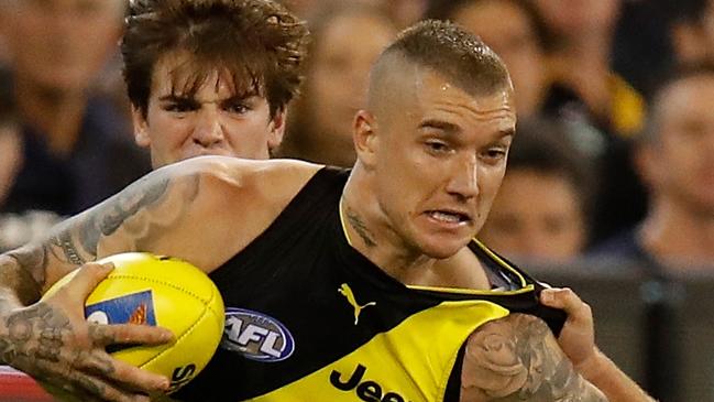 MELBOURNE, AUSTRALIA - MARCH 22: Dustin Martin of the Tigers fends off Dale Thomas of the Blues during the 2018 AFL round 01 match between the Richmond Tigers and the Carlton Blues at the Melbourne Cricket Ground on March 22, 2018 in Melbourne, Australia. (Photo by Michael Willson/AFL Media/Getty Images)