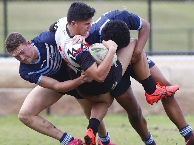 DAILY TELEGRAPH 22ND JUNE 2023Pictured being tackled with the ball is Erindale High player Lachlan Cunanan during a 2023 NSW Schoolboys Cup round between Matraville Sports High v Erindale High at Pioneers Park in Malabar.Picture: Richard Dobson