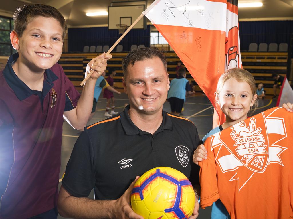 Toowoomba Anglican School students Hayden Johnston and Olivia McNicol talk football with Brisbane Roar Academy general manager Warren Moon, Monday, March 9, 2020. Picture: Kevin Farmer