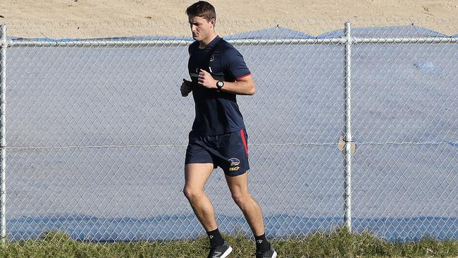 Matt Crouch runs laps at Football Park yesterday. Picture: Sarah Reed