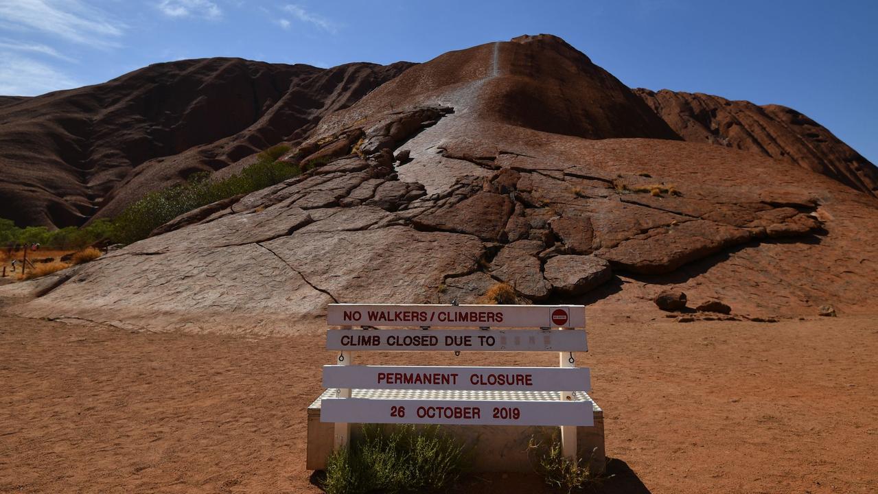 A notice for a permanent ban on climbing Uluru is seen at Uluru-Kata Tjuta National Park in Australia's Northern Territory on October 26, 2019. Picture: Saeed KHAN / AFP.