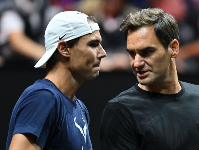 Switzerland's Roger Federer (R) speaks to Spain's Rafael Nadal. Picture: AFP