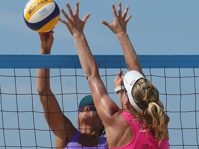 Mariafe Artacho Del Solar (AUS/NSW) attempts a spike while her opponent  Lucia Michalovicova (SVK) try to block in the women's final at the Australian Beach Volleyball Championship, Surfers Paradise, Gold Coast. Picture: Regi Varghese