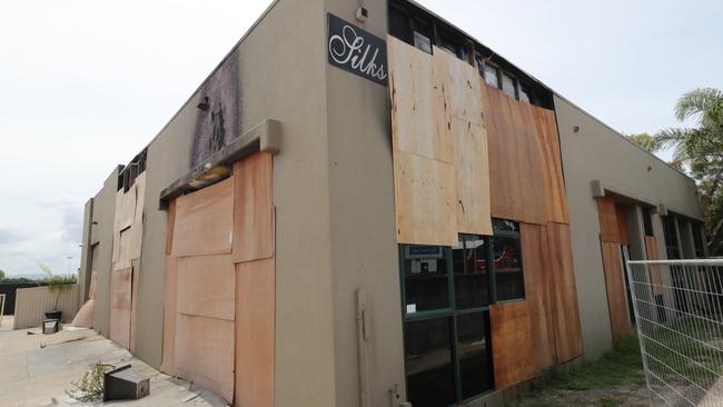 The boarded up shell of Silks brothel at Bundall after fire destroyed the premises in November. Picture: Glenn Hampson.