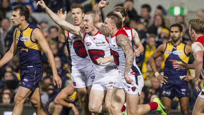 Melbourne players celebrate their incredible win against West Coast. Picture: AAP Images