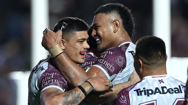 SYDNEY, AUSTRALIA - MAY 24:  TommyÃÂ Talau of the Sea Eagles celebrates with team mates after scoring a try during the round 12 NRL match between Manly Sea Eagles and Melbourne Storm at 4 Pines Park on May 24, 2024, in Sydney, Australia. (Photo by Cameron Spencer/Getty Images)