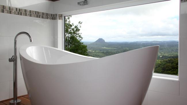 Sink into a deep bath while soaking in the view at Noosa Tablelands Escape