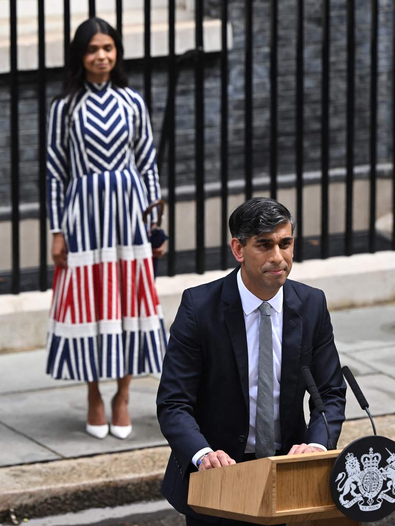 Mr Sunak was supported by his wife Akshata Murty as he delivered his statement. (Photo by JUSTIN TALLIS / AFP)