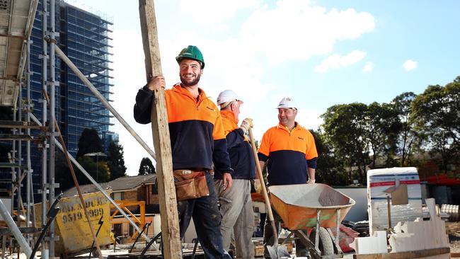 Residents are putting in 468 hours or 19.5 days over extra work each year: Tony El Wede, Adam Marogy and Ash Ezria pictured at a building site in Carlingford. Picture: Richard Dobson