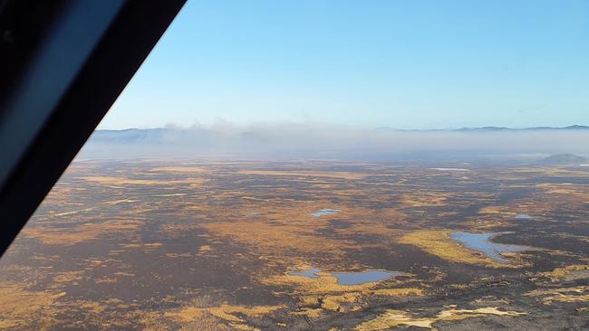 Diligent work by Queensland Parks and Wildlife Service rangers, supported by aerial water bombing and the use of bulldozers and graders contained the bushfire. Picture: Contributed