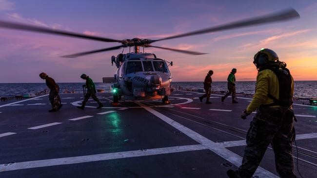 HMAS Hobart’s MH-60R helicopter ‘Voodoo’ prepares to launch during a regional presence deployment. Picture: Department of Defence