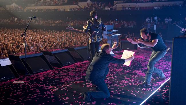 We’re not worthy! Tim bows to The Killers’ drummer before taking his spot behind the skins. Picture: Rob Loud