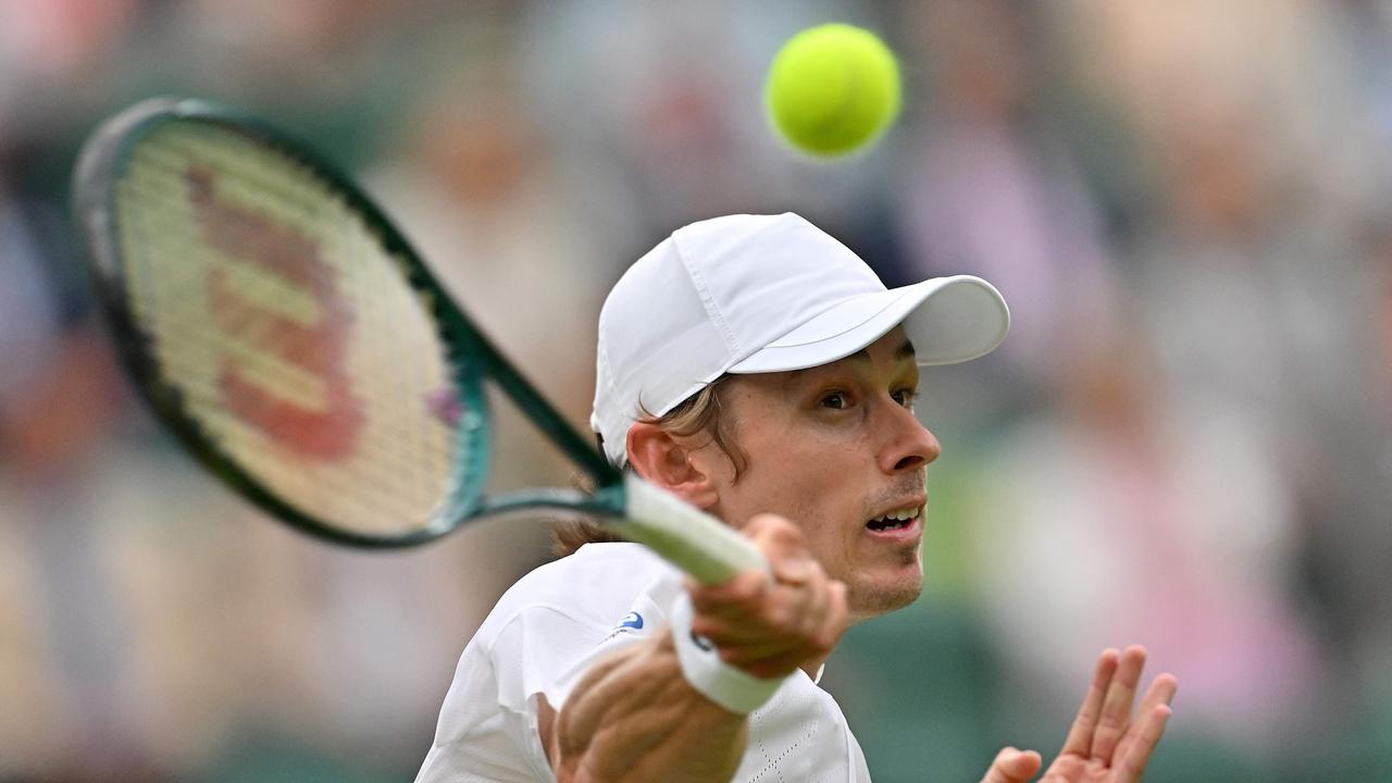 Australia's Alex De Minaur returns against France's Arthur Fils during their men's singles fourth round tennis match.