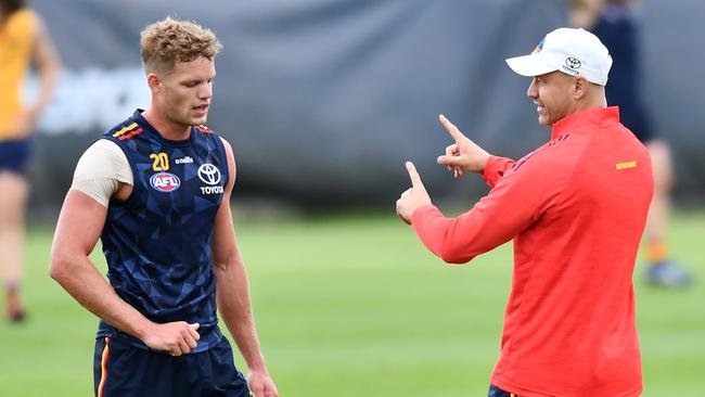 Crows coach Matthew Nicks, right, with Mitch Hinge at training. Picture: Mark Brake/Getty Images