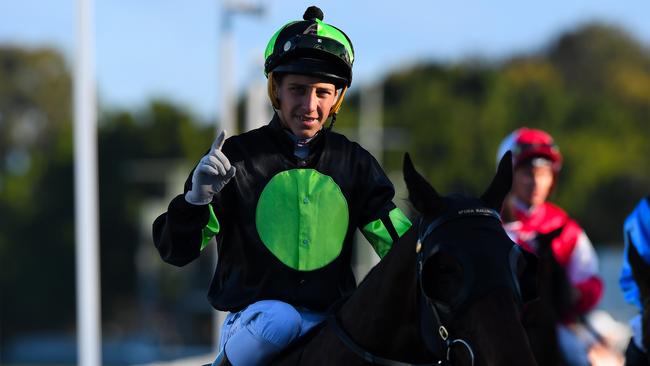 Jockey Jag Guthmann-Chester gestures after riding Lothario to win race 8, the CNW Electrical Wholesale Class 6 Handicap during the CNW Raceday at Aquis Park in the Gold Coast. Photo: Albert perez, AAP.