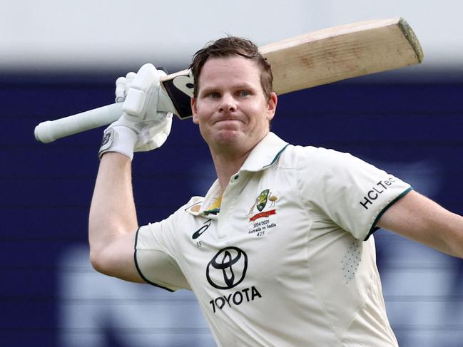 Australia's Steve Smith celebrates reaching his century on day two of the third cricket Test match between Australia and India at The Gabba in Brisbane on December 15, 2024. (Photo by DAVID GRAY / AFP) / -- IMAGE RESTRICTED TO EDITORIAL USE - STRICTLY NO COMMERCIAL USE --