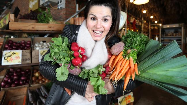 South Melbourne Market shopper Suzanna Pally goes plastic bag-free at Georgie's Harvest. Picture Rebecca Michael.